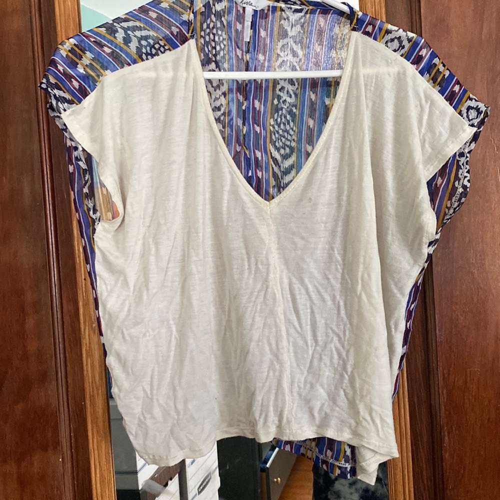 Cute white top with translucent print down back